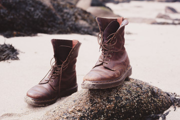 Pair of boots on the beach
