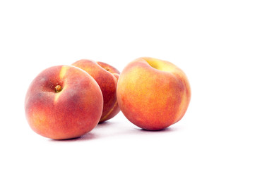 Fototapeta na wymiar three peaches