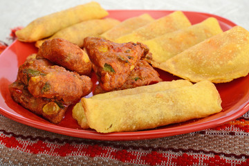 mexican snacks on red plate