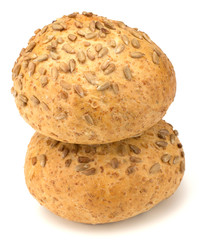 Round sandwich bun with sunflower seeds isolated on white backgr