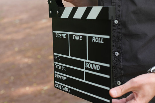 clapperboard in hands man