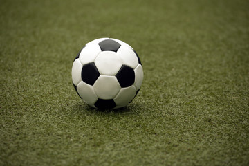 White and black ball for playing soccer close-up