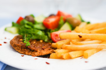 Steak with french fries and salad