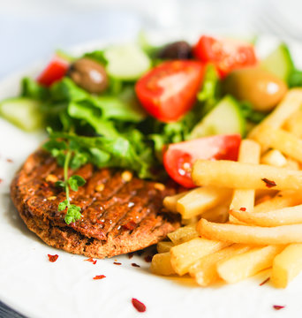 Steak with french fries and salad