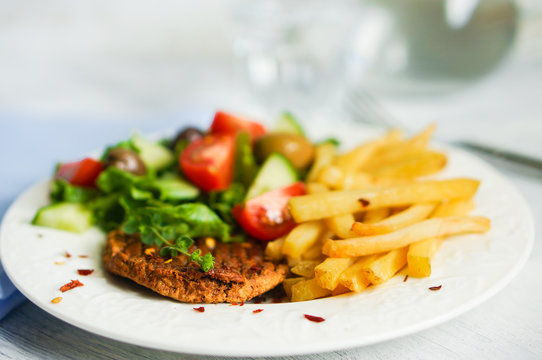 Steak with french fries and salad