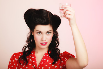 Retro. Pinup girl with glass of water drink