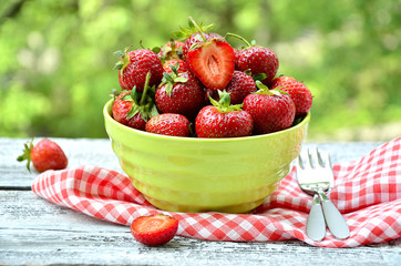 Strawberry in green bowl.