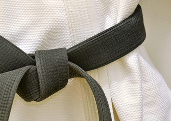 Karate Black Belt on White Uniform