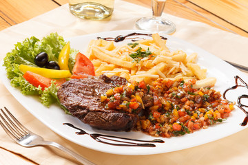 grilled steak with french fries