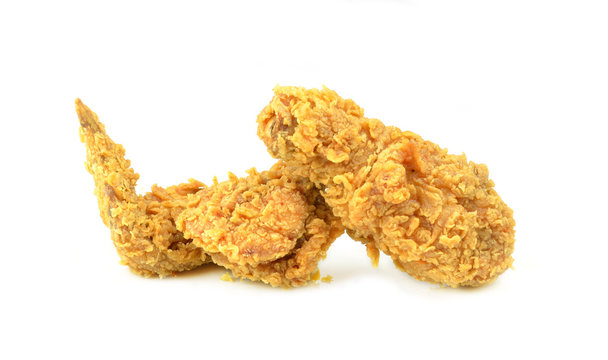 Golden brown fried chicken drumsticks