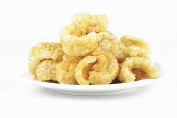 Pork rinds also known as chicharon or chicharrones, deep fried p
