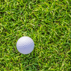 Golf ball on green grass