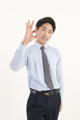 Asian young businessman giving okay sign