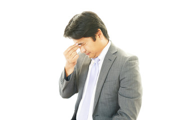 頭痛を訴えるビジネスマン