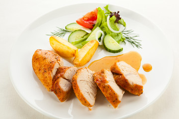 Roast chicken breast and vegetables