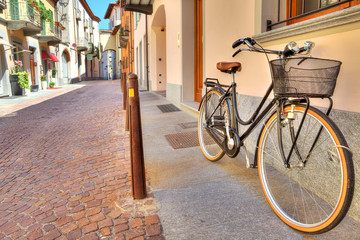 Fototapeta na wymiar Bicycle on the street of Alba, Italy.