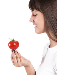 Isolated beautiful woman  looking the  tomatoe.