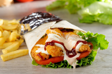 Tortilla with Chicken nuggets, french fries and vegetables