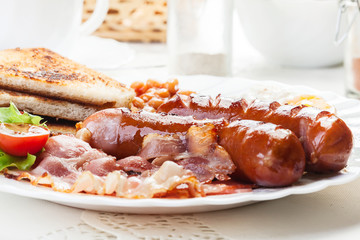Full English breakfast with bacon, sausage, egg and beans