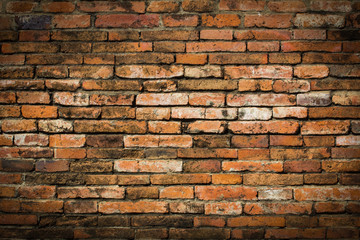 Weathered stained old brick wall background.