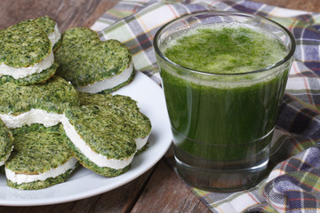 green heart shaped cookies and a cocktail of fresh spinach