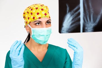 Fototapeta na wymiar Female surgeon looking X-Ray