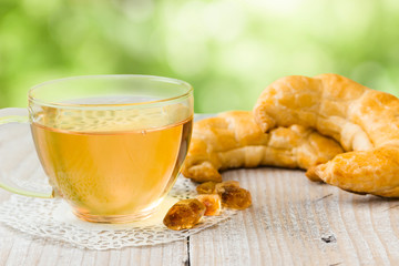 Cup of tea and two croissants