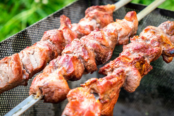 Hot shish kebab on metal skewers