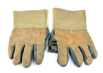Dirty leather glove isolated on white background