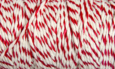 Roll of red and white rope for parcel