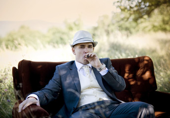 Handsome groom with cigarette