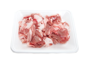 fresh red meat chopped lying in plastic tray
