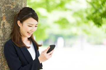 asian businesswoman using smart phone