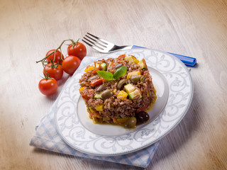 rice with zucchinis capsicum olives and tomatoes