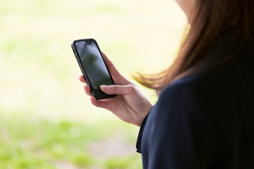 asian businesswoman using smart phone