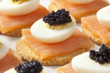 Snack with salmon,quail eggs and lumpfish roe