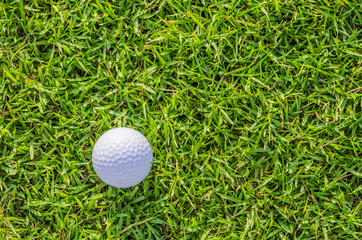 Golf ball on green grass