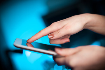Finger pointing on tablet pc with empty space