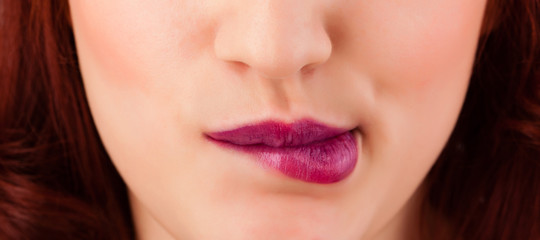 Fototapeta premium Beautiful woman red lips close up