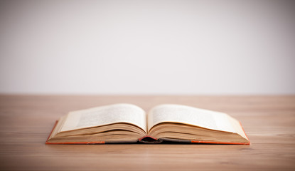 Open book on wooden deck