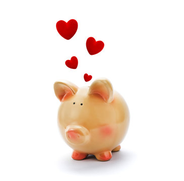 Piggy bank with red hearts above