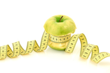 measuring tape and apple