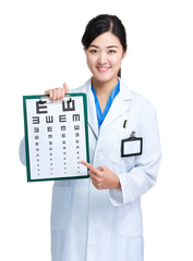 Female doctor hold eye chart