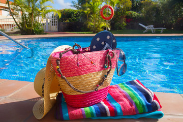 towel and bathing accessories near pool