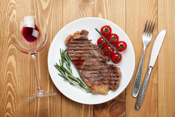 Sirloin steak with rosemary and cherry tomatoes on a plate