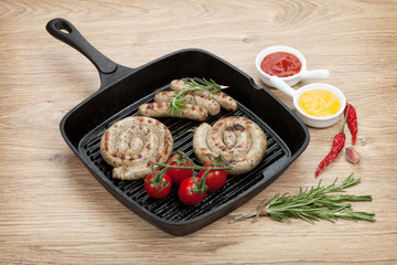 Grilled sausages with ketchup and mustard