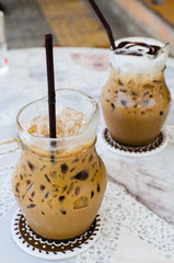 Ice coffee on marble table.