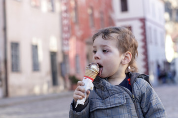 Kid licks ice cream