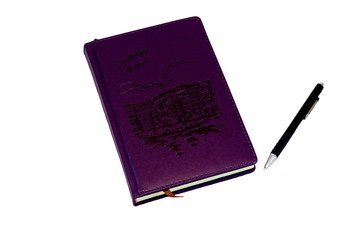 Obraz premium Lilac on white background notebook, which lies near black red