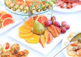 catering table set service with silverware and glass